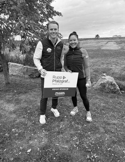 Jen and Jerry with sponsorship sign for charity walk