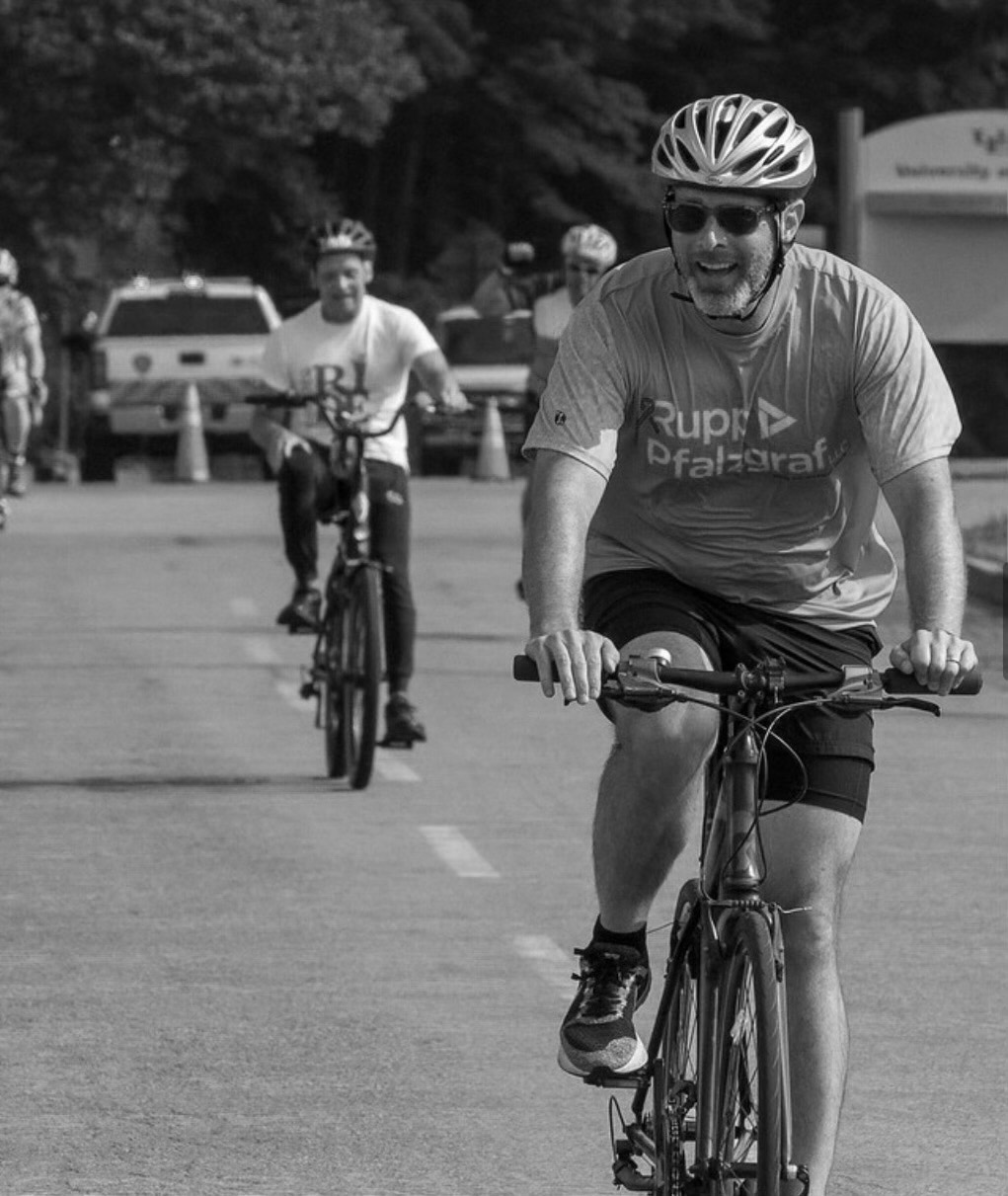 team member participating in cycling event